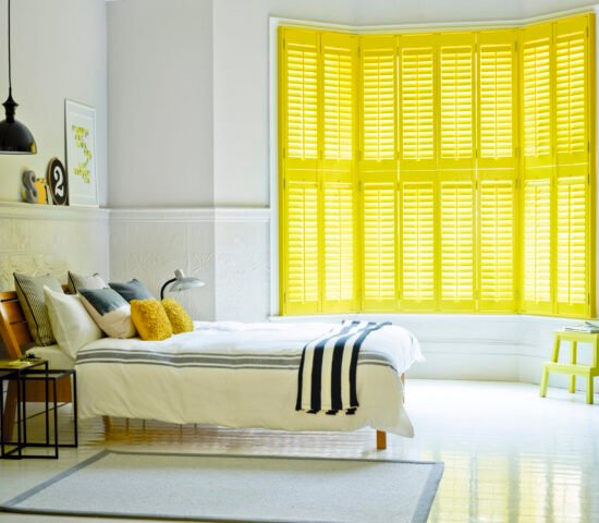 Yellow-Bedroom-Bay-Shutters-Hybrawood